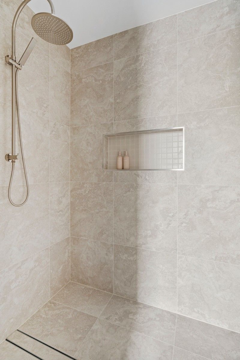 Tiled shower with recessed niche and brushed nickel rail shower